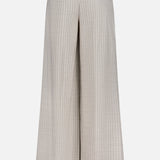 The Allanah Mid Rise Trouser Pant by L'AGENCE features a wide-leg, high-waisted silhouette in tan Italian suiting with thin pinstripes, two back welt pockets, and belt loops—timeless style shown on a plain white background.