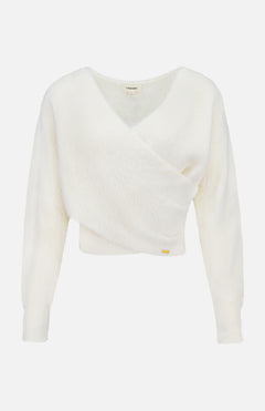 The Antonella Surplus Pullover Sweater by L'AGENCE is an ivory, cropped knit with a soft, fluffy texture. It features a white long-sleeve V-neck wrap design and is displayed on a plain background.