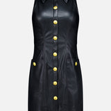 The Apolline Collar Racer Mini Dress by L’AGENCE is a sleeveless black vegan leather mini dress with a collared neckline and front gold button closure, featuring two pockets adorned with matching gold buttons. The dress is displayed on a plain white background.