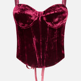 L’Agence Ariana Lace Up Corset Top in dark red velvet, featuring molded cups, shoulder straps, ribbon ties at the hem, and a lace-up back.