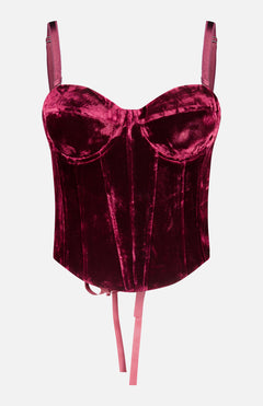L’Agence Ariana Lace Up Corset Top in dark red velvet, featuring molded cups, shoulder straps, ribbon ties at the hem, and a lace-up back.