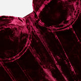 L’Agence Ariana Lace Up Corset Top in deep red velvet, featuring molded cups, structural seams, and a lace-up back.