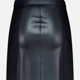 The Arlena Whipstitch Mini Skirt by L’AGENCE is a black vegan leather skirt featuring visible stitched seams, a fitted waistband, and a smooth, shiny finish, shown against a plain white background.
