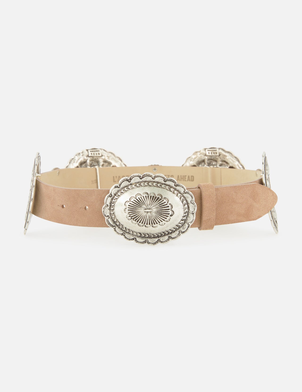 The L'AGENCE Austin Concho Medlin Belt is a tan suede belt adorned with large, oval silver conchos engraved with floral patterns, shown on a white background.
