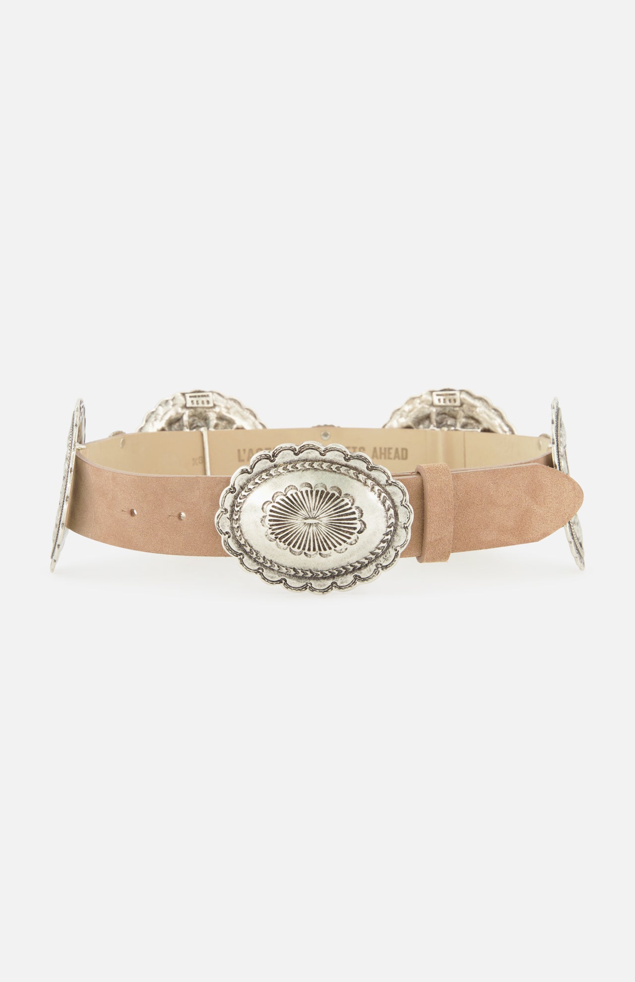 The L'AGENCE Austin Concho Medlin Belt is a tan suede belt adorned with large, oval silver conchos engraved with floral patterns, shown on a white background.
