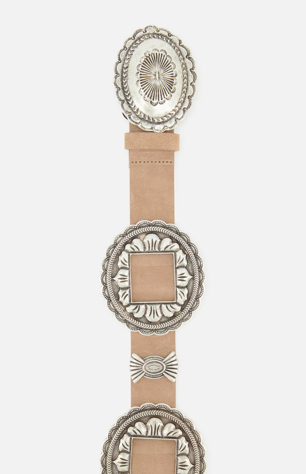 The Austin Concho Medlin Belt by L'AGENCE is a light brown leather statement piece with ornate silver-toned engraved concho accents in round and square shapes, decorative edging, and intricate patterns.