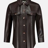 The L’AGENCE Avina Leather 3/4 Sleeve Blouse in dark brown features a pointed collar, front button closure, and two chest pockets with flaps, all showcased on a plain white background. This coffee bean blouse offers timeless style and luxury for an elegant, sophisticated look.