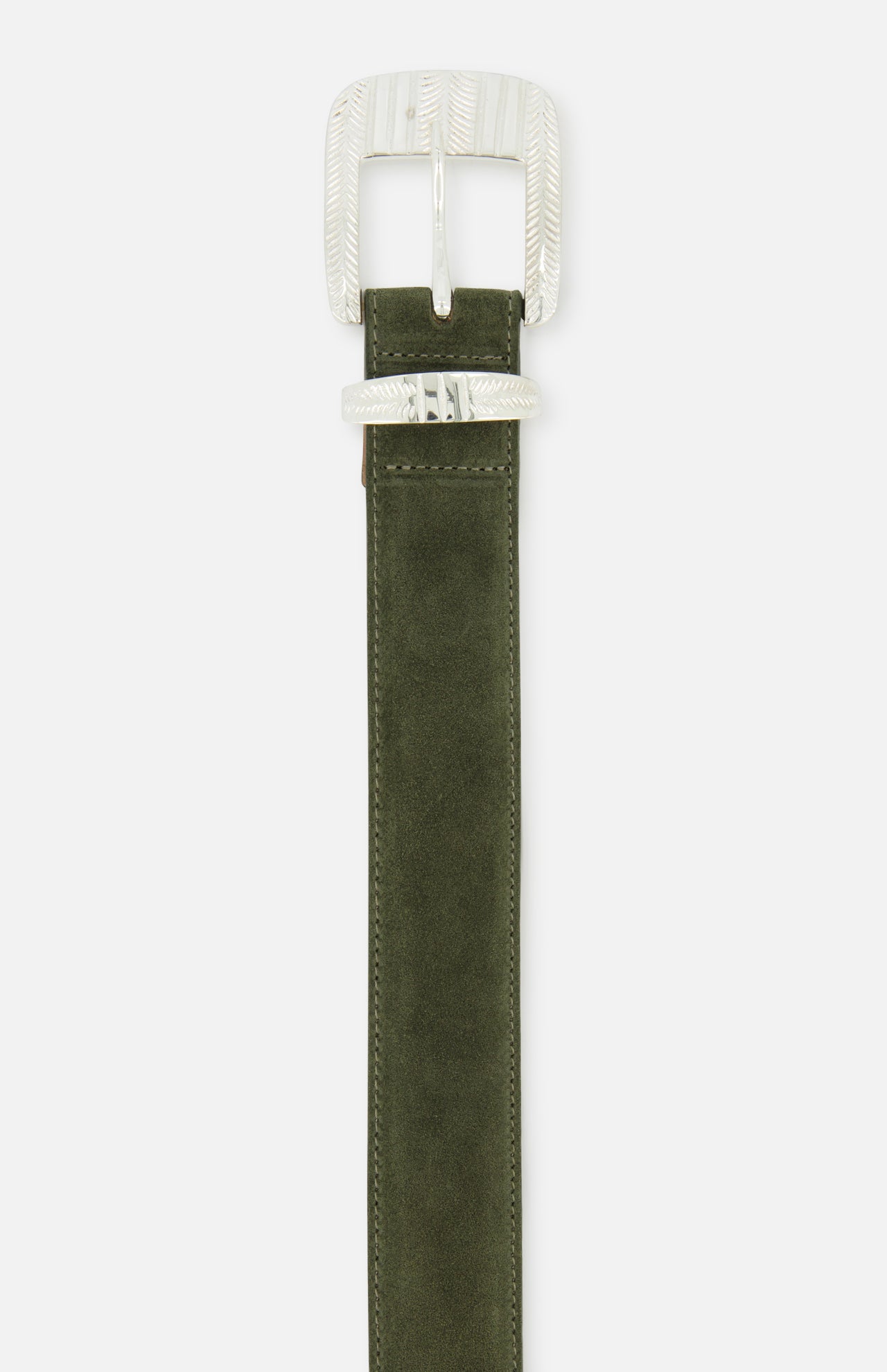The Aya Western Engraved Belt by L'AGENCE features an olive green suede design with a silver, textured rectangular buckle and matching belt loop, photographed against a white background. This Western-inspired accessory adds a stylish touch to any outfit.