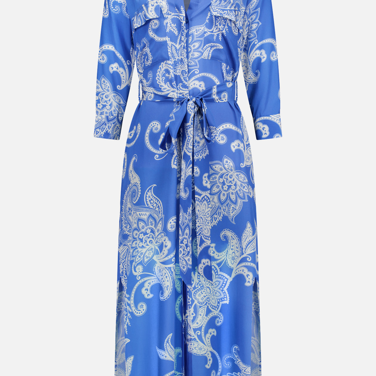 The Cameron Long Silk Shirt Dress by L'AGENCE is a relaxed-fit, floor-length blue and ivory dress with a white paisley print, collared neckline, long sleeves, belted waist, button-down front, and two chest pockets.