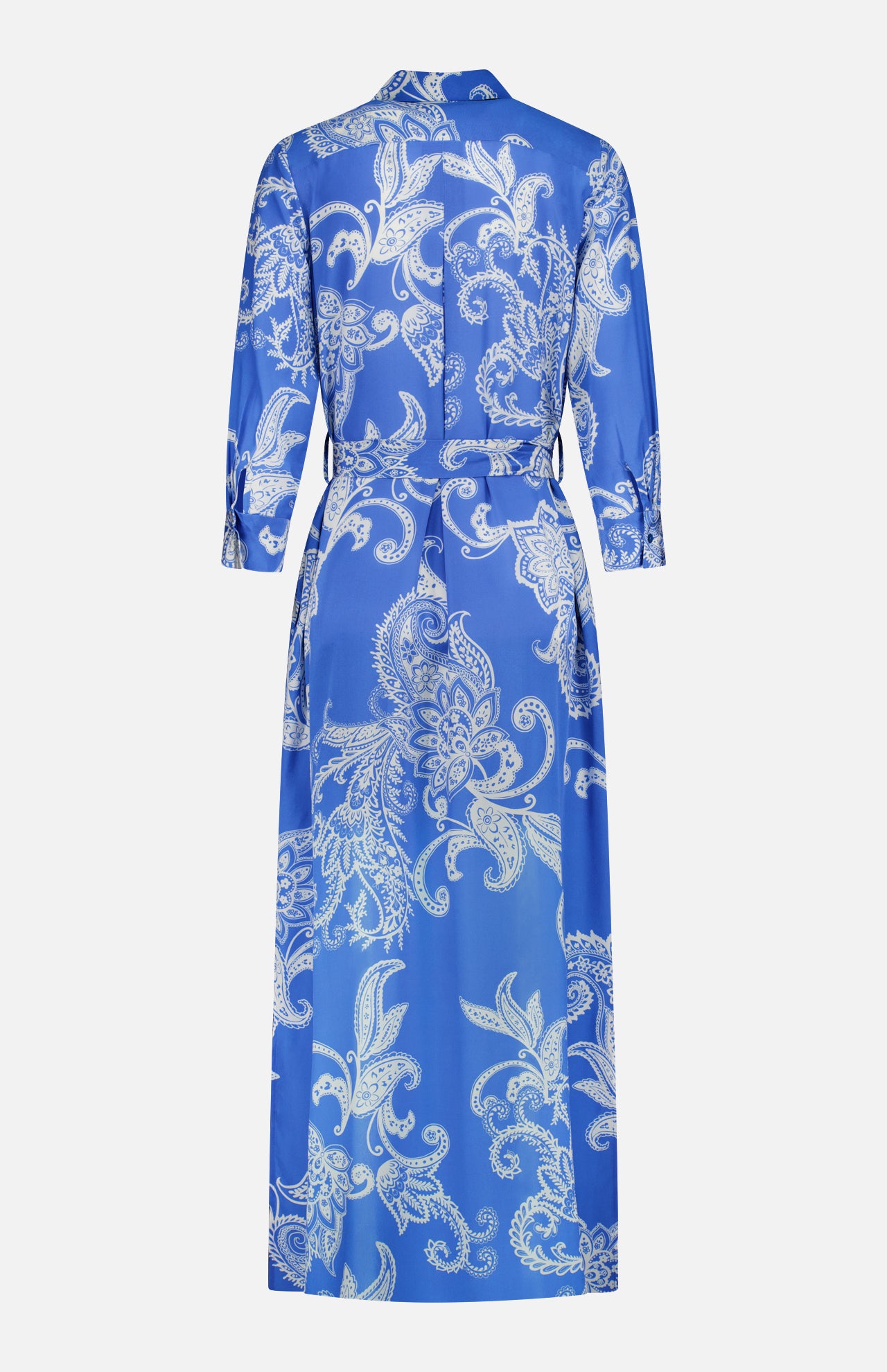 The L'AGENCE Cameron Long Silk Shirt Dress is a floor-length blue and ivory piece with long sleeves, white paisley pattern, belted waist, and straight hem. Shown from the back, this maxi offers an elegant, timeless silhouette.