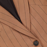Close-up of the Chamberlain Pinstripe Blazer by L'AGENCE, showcasing its brown pinstripe fabric, black button closure, tailored lapel, chest pocket, and a glimpse of the dark inner lining—an elegant women’s office blazer.