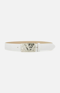 The Chara Organic Hammer Belt by L'AGENCE is a white leather belt with a textured finish and a rectangular marbled silver buckle with black accents, shown against a plain white background.