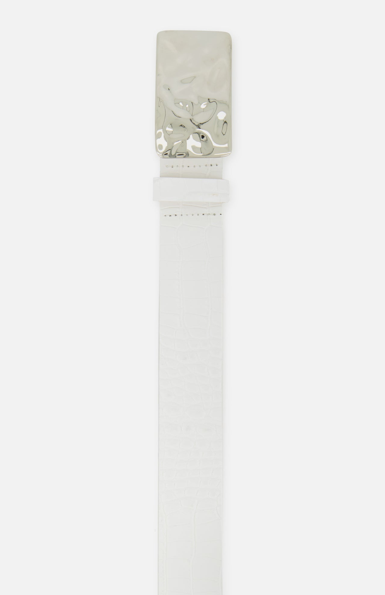 The Chara Organic Hammer Belt by L'AGENCE features white croc-embossed leather and a shiny, wavy silver rectangular buckle. Laid flat on a white background, its textured finish and bold design are highlighted.