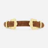 The Chayenne Ornate Double Belt by L’AGENCE, a brown suede accessory accented with two intricate gold-plated buckles featuring floral designs, is elegantly displayed against a plain white background.
