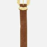 The Chayenne Ornate Double Belt by L’AGENCE features a rich brown suede design accented with a decorative, ornate gold-plated buckle and a matching gold belt loop, presented against a plain white background.