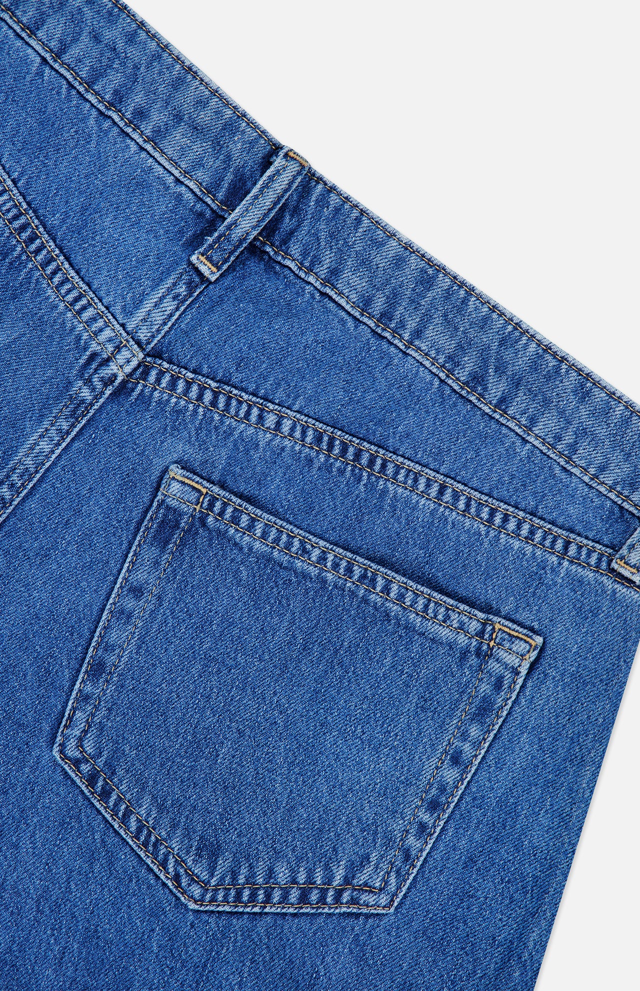 Close-up of the back pocket and waistband of the L’AGENCE Chayse High Rise Super Wide Leg Jean in Towson, highlighting stitching details and texture.