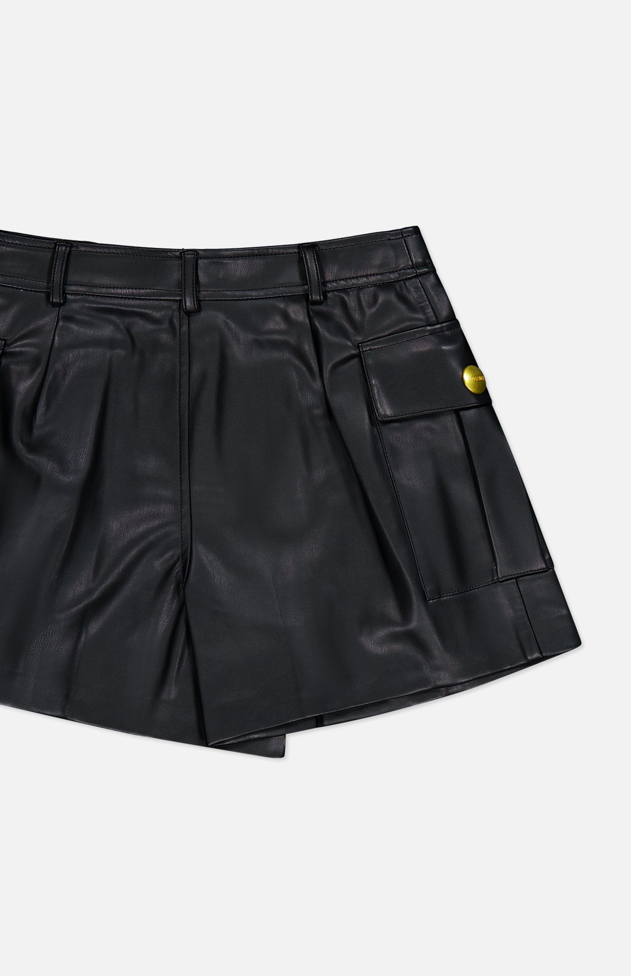 L’Agence Clairmont Cargo Shorts in black faux leather, featuring a gold button on the side pocket.