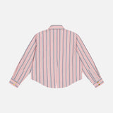 The Cosette Crop Hi Low Shirt by L'AGENCE is a pink long-sleeve top with vertical navy and white stripes, shown from the back, featuring a collar, yellow cuff buttons, and a cropped high-low hem.
