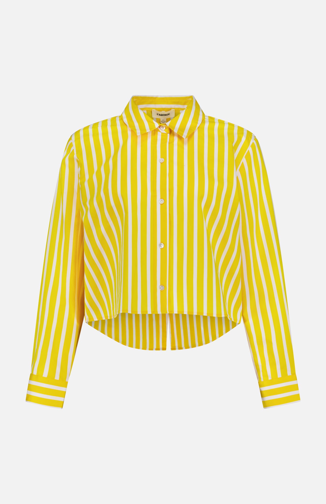 The Cosette Crop Hi Low Shirt by L'AGENCE is a collared, long-sleeve button-up with bold yellow and white vertical stripes and a gently curved hem.