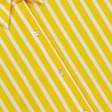 Close-up of the Cosette Crop Hi Low Shirt by L'AGENCE—yellow with white diagonal stripes, white buttons, and a collar. Crafted from organic cotton, this tailored shirt blends summer comfort and style.