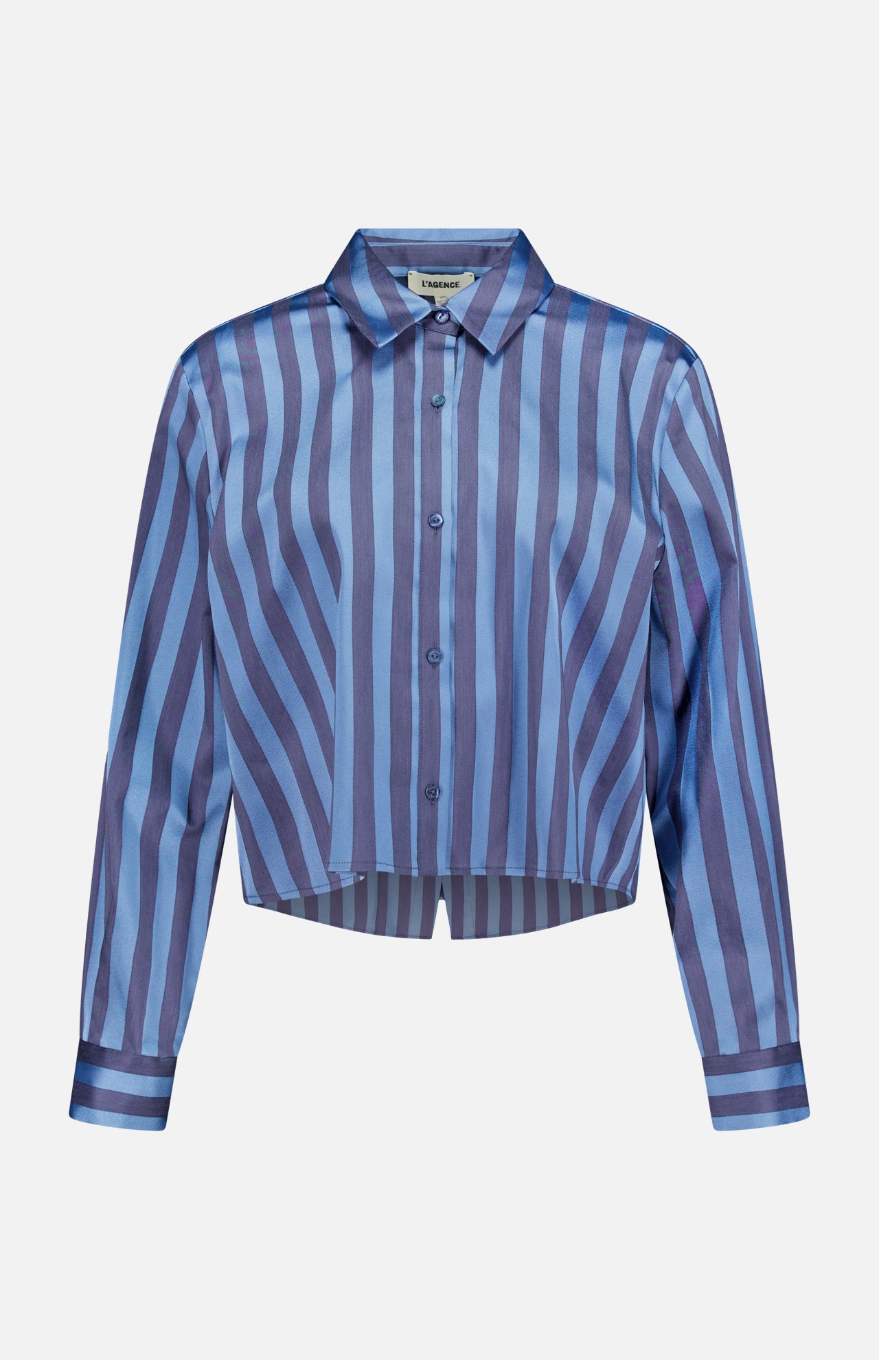 The Cosette Cropped Hi Low Shirt by L'AGENCE features long sleeves, a pointed collar, a slightly cropped hem, and vertical and diagonal blue and purple stripes.
