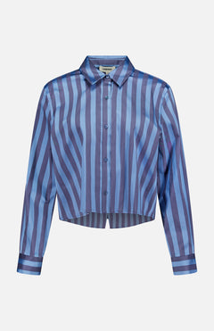 The Cosette Cropped Hi Low Shirt by L'AGENCE features long sleeves, a pointed collar, a slightly cropped hem, and vertical and diagonal blue and purple stripes.