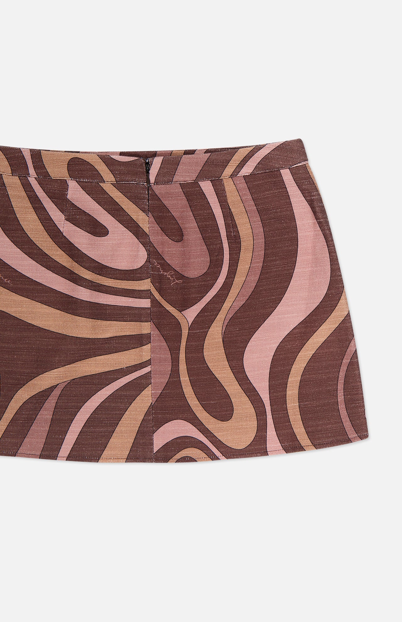 The Cyra Low Rise Mini Skirt by L'AGENCE is showcased against a white background. This mini skirt features a bold, abstract swirl print in wavy brown, pink, and beige patterns. It has a low rise fit with a fitted waistband and a center seam for added detail.