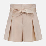 The Damira Paperbag Short by L'AGENCE features a beige hue, side pleats, and a matching self-tie belt bow at the front, shown against a plain white background.