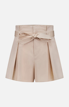 The Damira Paperbag Short by L'AGENCE features a beige hue, side pleats, and a matching self-tie belt bow at the front, shown against a plain white background.