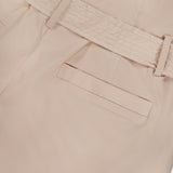 Close-up of the back of the L'AGENCE Damira Paperbag Short in beige, featuring a self-tie belt, belt loop, and single welt pocket.