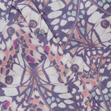 Close-up of the L'AGENCE Dani 3/4 Sleeve Butterfly Print Blouse, featuring a vibrant geometric butterfly wing pattern in purple, pink, white, and blue with shiny silver buttons.
