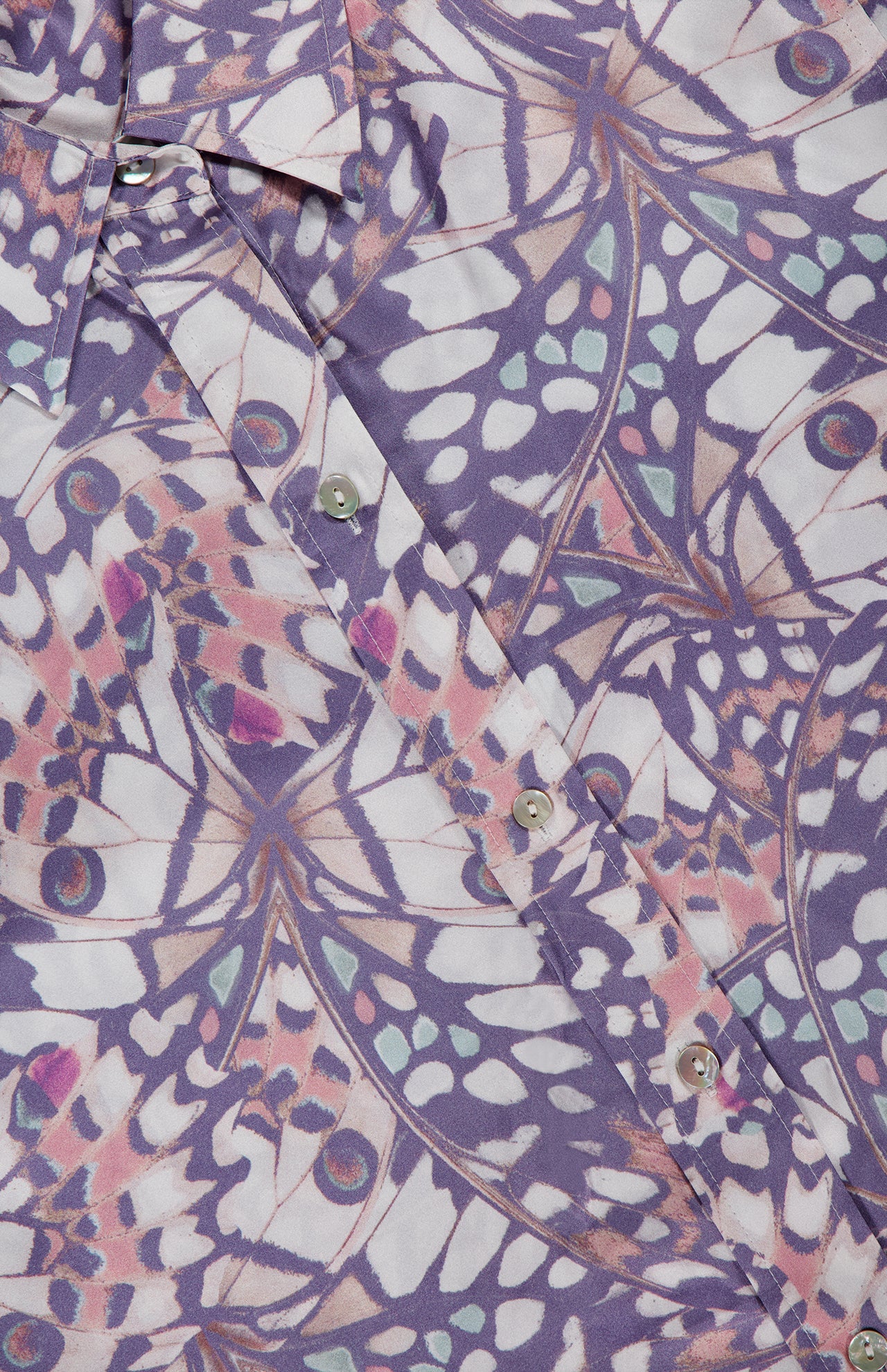 Close-up of the L'AGENCE Dani 3/4 Sleeve Butterfly Print Blouse, featuring a vibrant geometric butterfly wing pattern in purple, pink, white, and blue with shiny silver buttons.