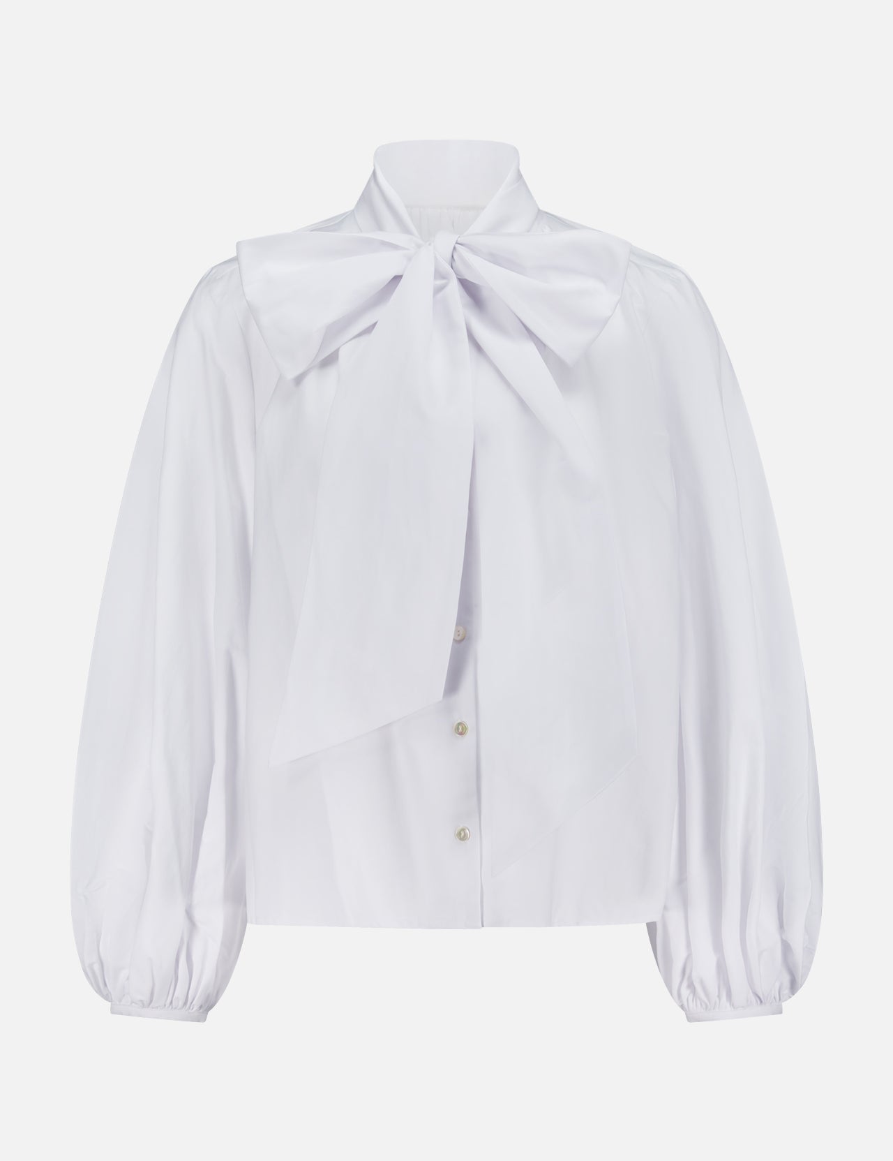 The Deon Tie Neck Blouse by L'AGENCE is a white button-down top featuring long blouson sleeves and a bold bow detail at the collar.