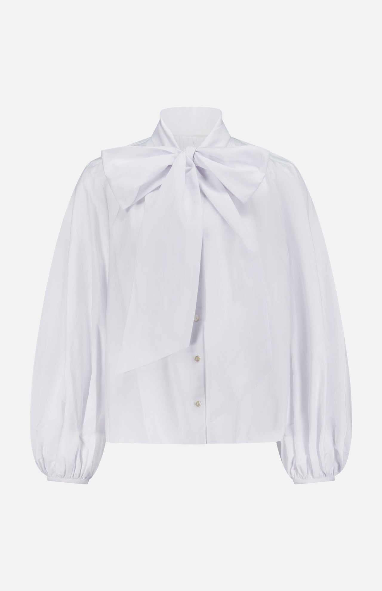 The Deon Tie Neck Blouse by L'AGENCE is a white button-down top featuring long blouson sleeves and a bold bow detail at the collar.