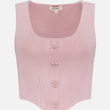 The Dove Scoop Neck Knit Corset Top by L’AGENCE is a sleeveless pale pink power knit with a scoop neck, ribbed details, four large front buttons, a curved hem, and a visible label at the collar.