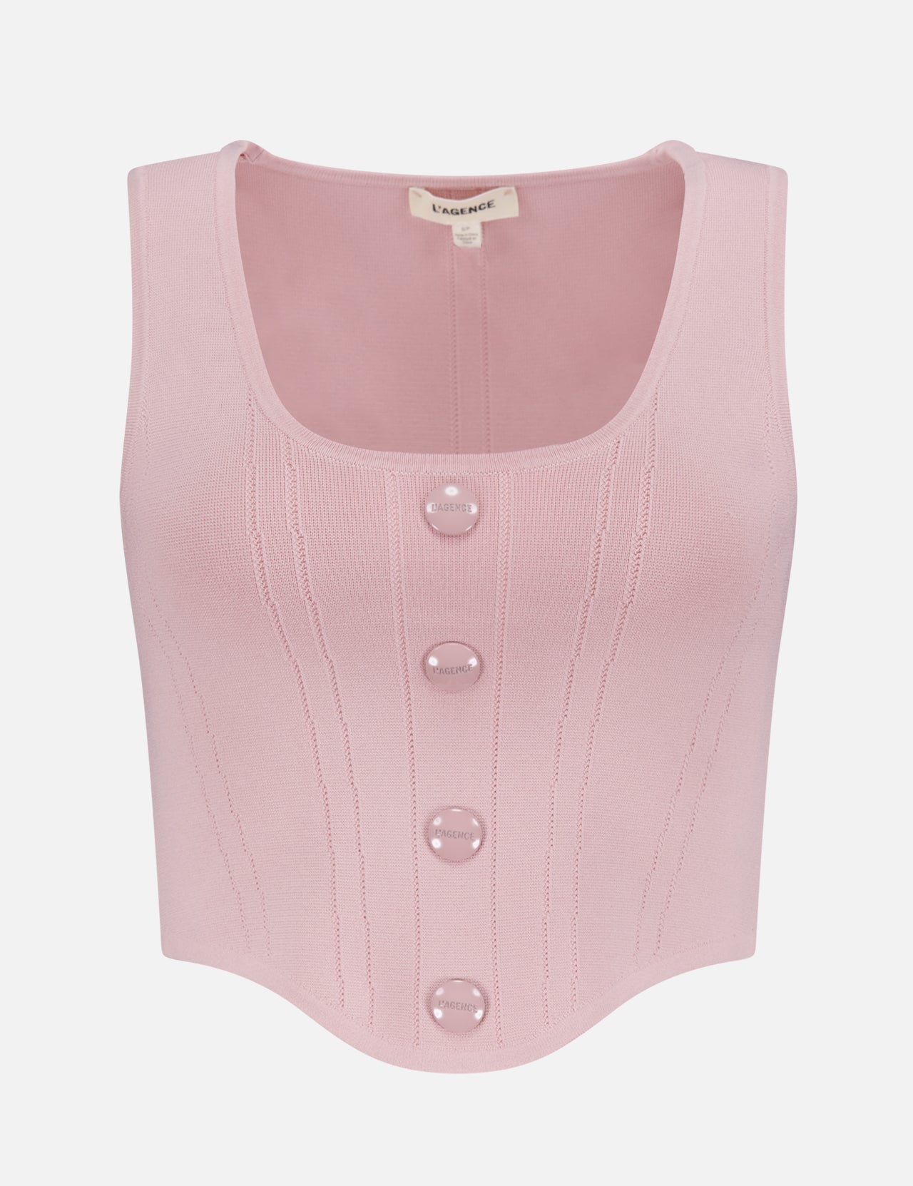 The Dove Scoop Neck Knit Corset Top by L’AGENCE is a sleeveless pale pink power knit with a scoop neck, ribbed details, four large front buttons, a curved hem, and a visible label at the collar.
