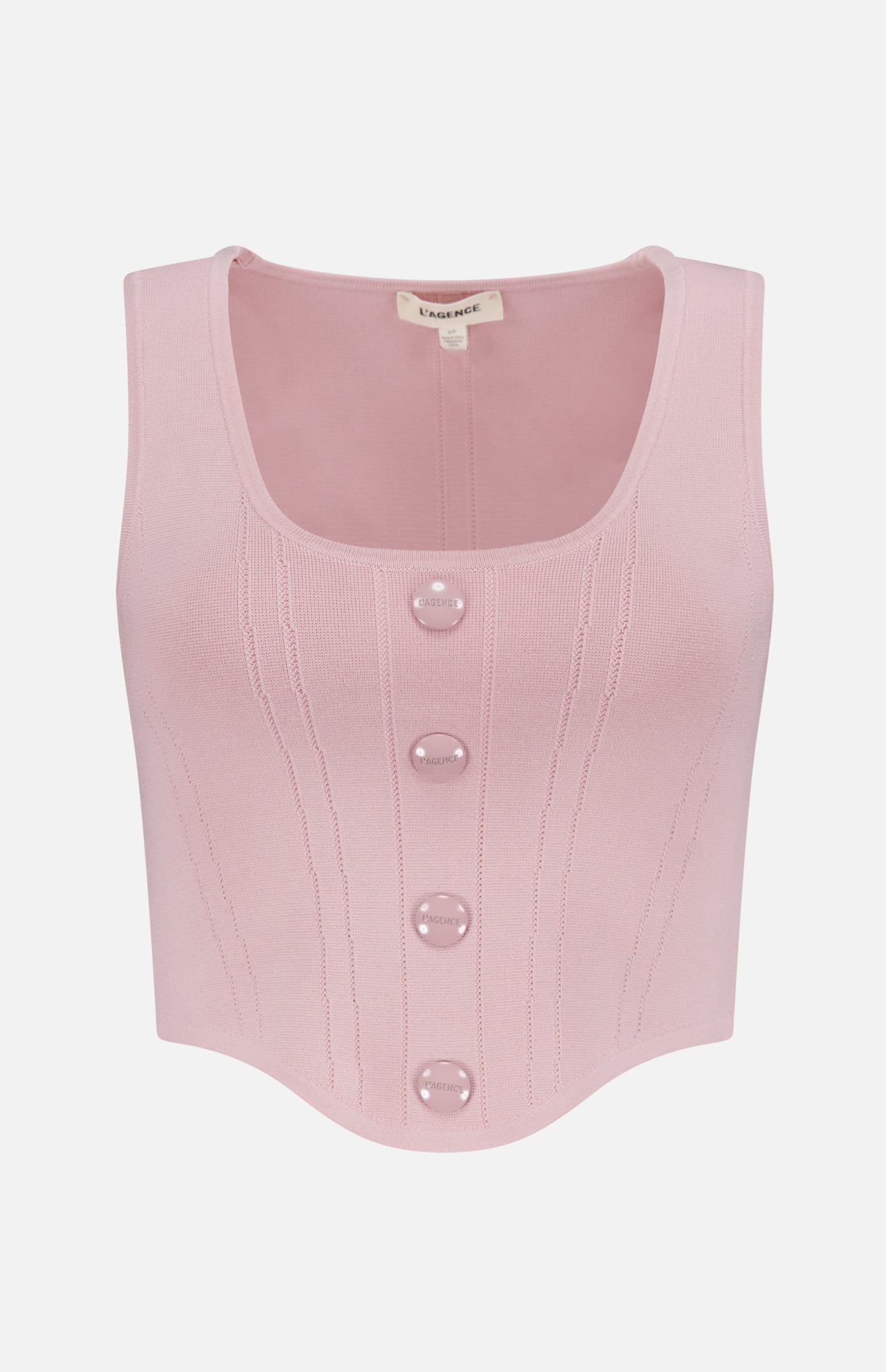 The Dove Scoop Neck Knit Corset Top by L’AGENCE is a sleeveless pale pink power knit with a scoop neck, ribbed details, four large front buttons, a curved hem, and a visible label at the collar.