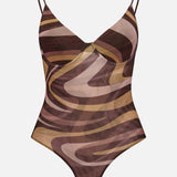 The Elowen Underwire Swirl Print Bodysuit by L'AGENCE features a brown and beige abstract swirl print, thin shoulder straps, a V-neckline, and high-cut legs, displayed against a plain white background.