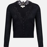 The Eluna Lace Detail Cardigan by L’AGENCE is a black long-sleeve sweater featuring elegant lace accents around the deep V-neckline and matching black buttons down the front. This lightweight transitional piece is showcased against a plain white background.