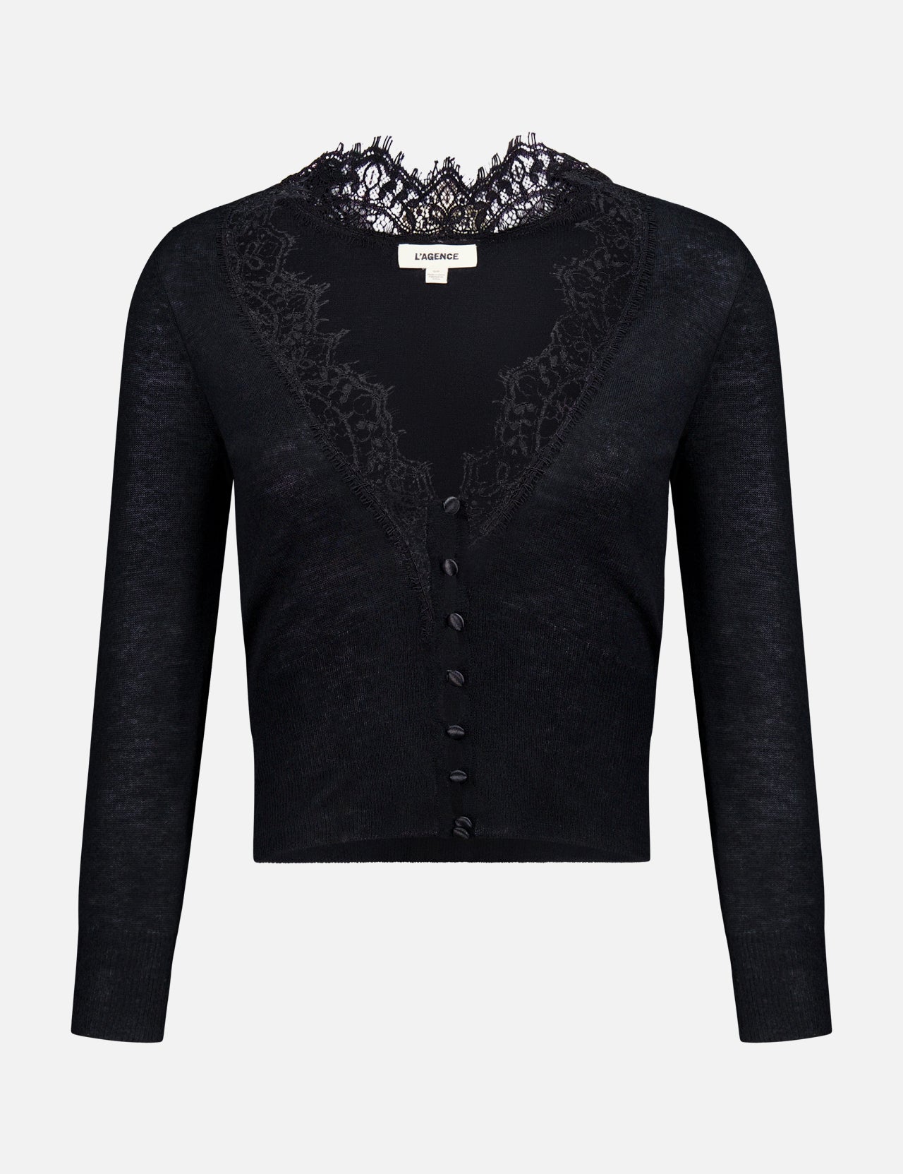 The Eluna Lace Detail Cardigan by L’AGENCE is a black long-sleeve sweater featuring elegant lace accents around the deep V-neckline and matching black buttons down the front. This lightweight transitional piece is showcased against a plain white background.