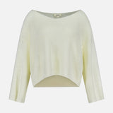 The Ethan Knit Pullover Sweater by L'AGENCE features a light yellow, open-weave knit, long sleeves, a wide boat neckline, and a slightly curved cropped hem, shown on a plain white background.