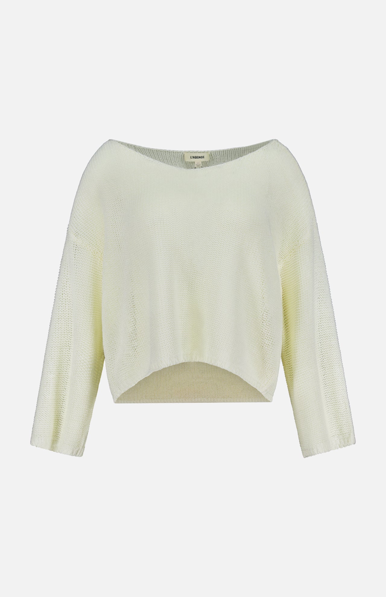 The Ethan Knit Pullover Sweater by L'AGENCE features a light yellow, open-weave knit, long sleeves, a wide boat neckline, and a slightly curved cropped hem, shown on a plain white background.