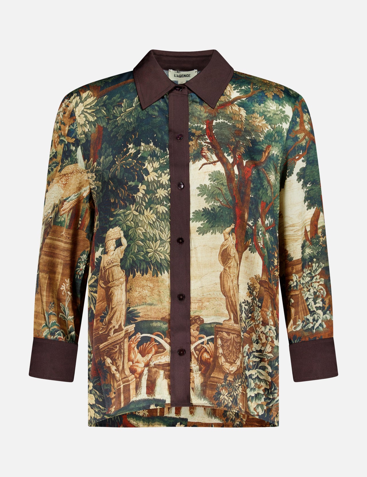 L’Agence Eulalie Print Placement Blouse, a long-sleeved button-up featuring a dark brown collar and cuffs with an all-over tapestry print of classical statues and trees.