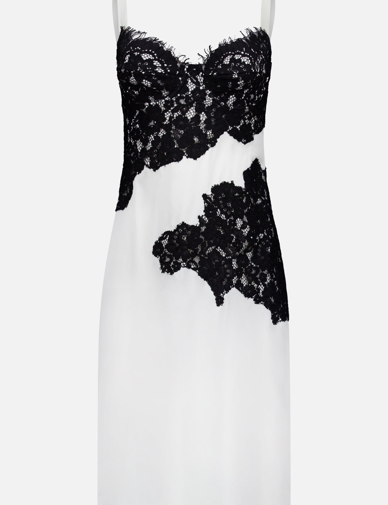 The Fenna Lace Applique Dress by L'AGENCE is a sleeveless ivory silk dress with black lace detailing on the bustier, midsection, and lower right side. It features thin straps and a fitted silhouette.