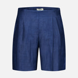 The Hadleigh Long Linen Short by L’AGENCE features a tailored high-rise fit in dark blue linen-blend with subtle pleats and a flat front, shown against a plain white background.