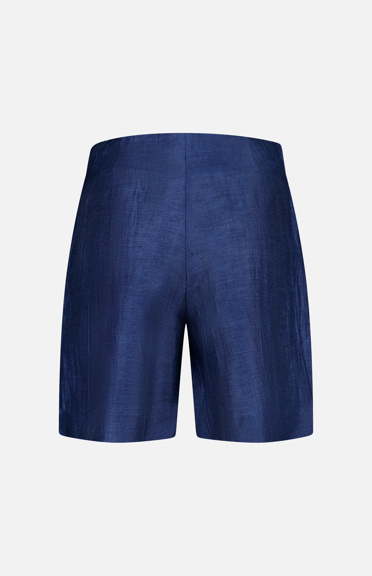 The Hadleigh Long Linen Short by L'AGENCE is a pair of high-rise, dark blue dress shorts crafted from a slightly shiny, textured linen blend, shown from the back against a plain white background.