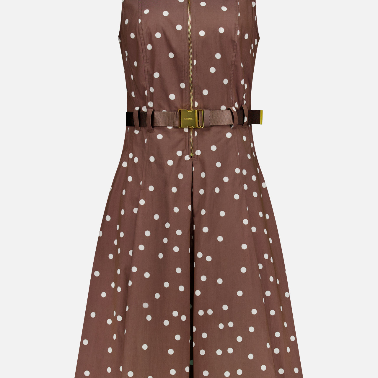 The Kylo Belted Shirt Dress by L'AGENCE features a sleeveless design, light brown color with polka dots, collared neckline, front zipper, fitted waist with matching belt, and a flared knee-length skirt.