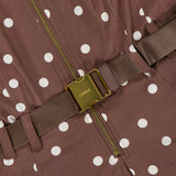 Close-up of the Kylo Belted Shirt Dress by L'AGENCE, featuring brown poplin fabric with white polka dots, a gold zipper, and a brown belt with a gold LANCEL buckle. The material is light and tailored in a classic shirt dress style.