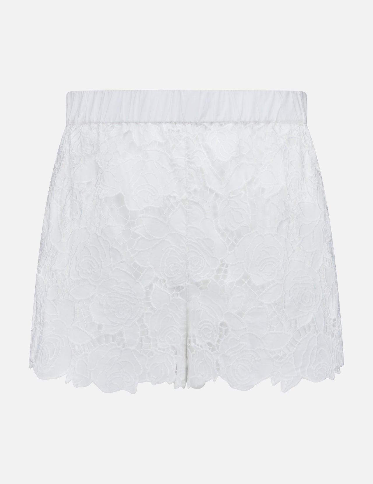 The L'AGENCE Laina Pull On Eyelet Short features a floral eyelet design, elastic waistband, scalloped hem, and cotton lining with a semi-sheer overlay for a delicate look.