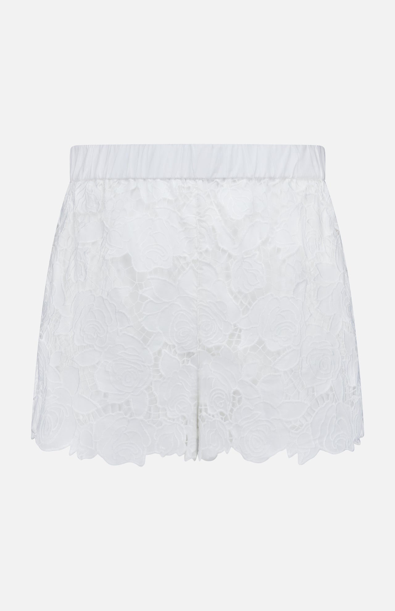 The L'AGENCE Laina Pull On Eyelet Short features a floral eyelet design, elastic waistband, scalloped hem, and cotton lining with a semi-sheer overlay for a delicate look.